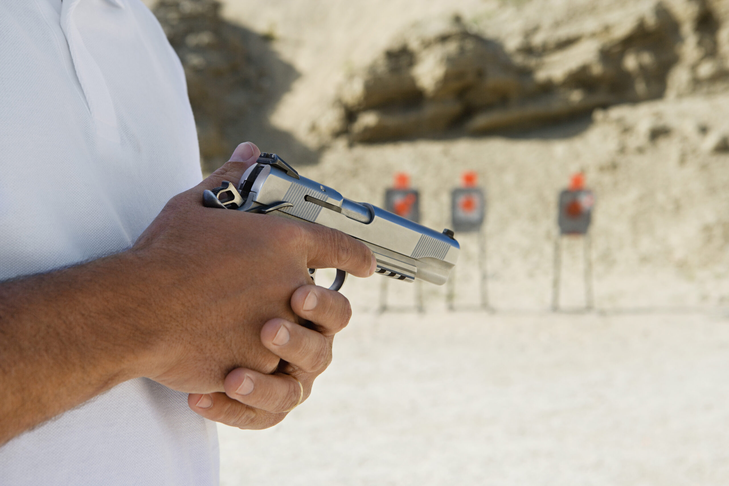 Midsection Of A Man holding Hand Gun